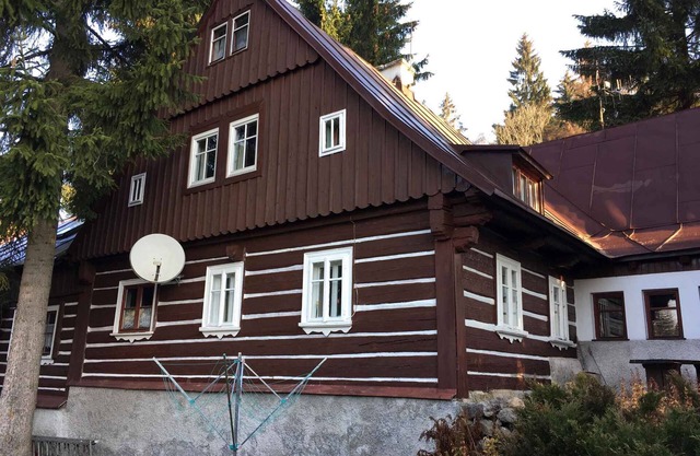 Holiday home stylishly furnished with fireplace and sauna
