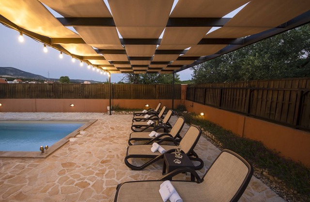 Holiday house with pool on large plot in a green landscape