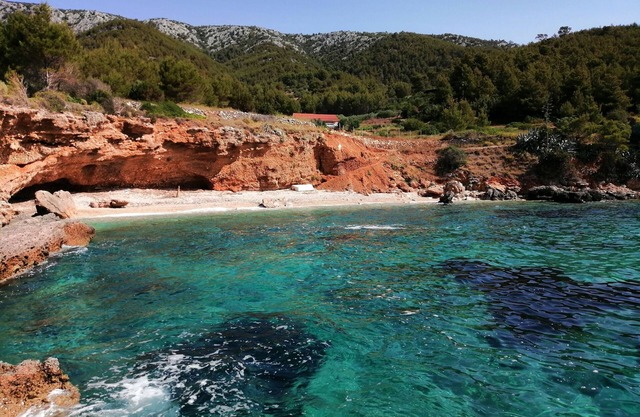 House Gnjila in the bay above the beautiful beach in Gromin Dolac