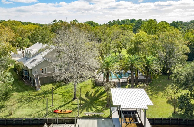 Immaculate waterfront retreat on 4 acres with private pool & dock