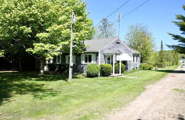 In the narrows on Lake Leelanau, pet friendly, sleeps 8, and a dock!