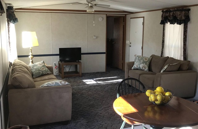 In-town home, walk to restaurants; property borders scenic hiking trail.