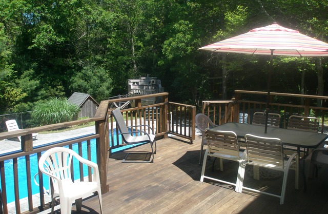 Inground Pool with patio, large deck, ship playhouse and swing