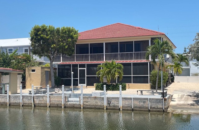 Islamorada home with private boat ramp and beautiful private beach access.