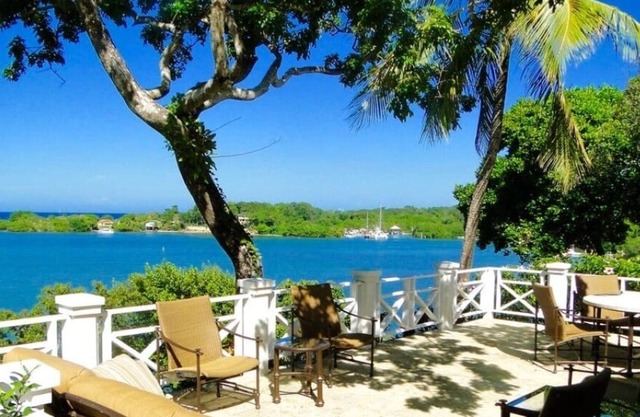 Island Escape. Waterfront with pool and lush tropical garden