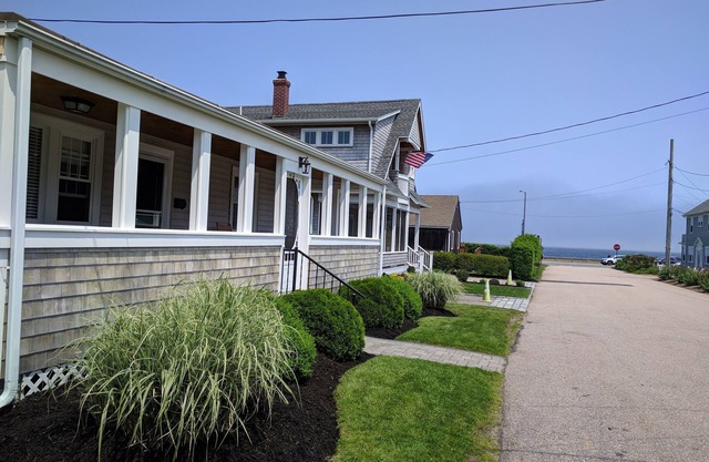 Just reduced! Great location! Feet from the seawall, walk to Narr. town beach.