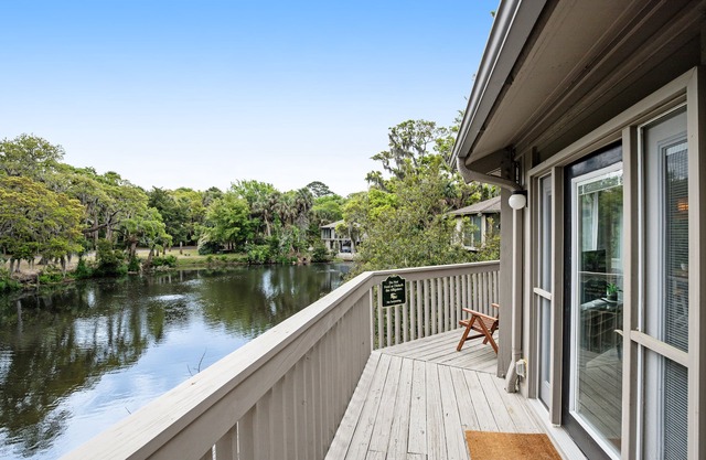 Lakefront home with lagoon view, deck & AC - close to beach, golf, & pools