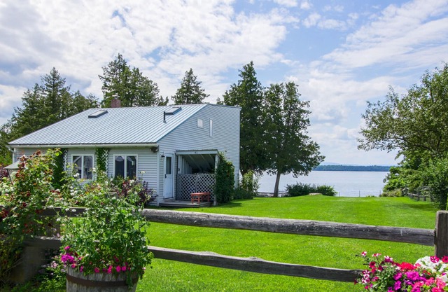 Lakefront Home with Patio Over the Lake, Private Dock, & Stunning Sunset Views