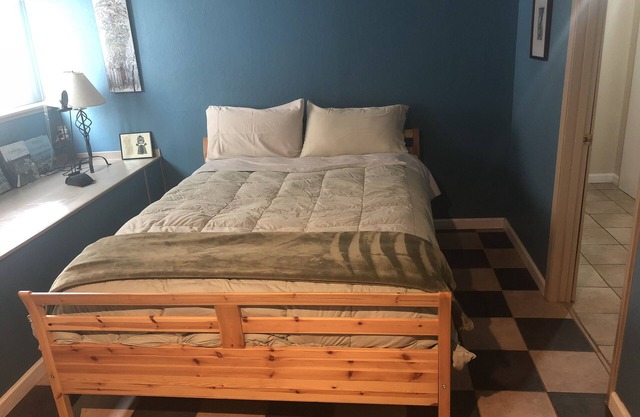 Large bedroom, bathroom & tenant kitchen, with lounge area and patio