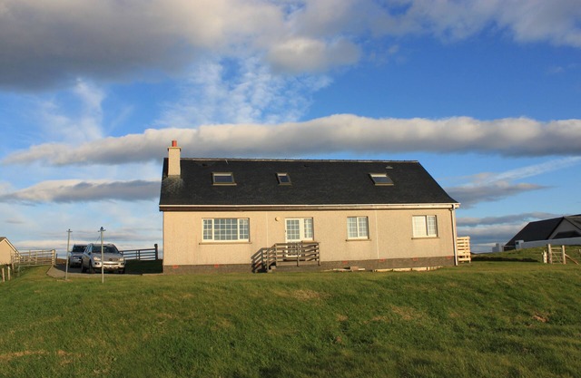 Large bungalow with spectacular views over Stornoway, the Minch and mainland.