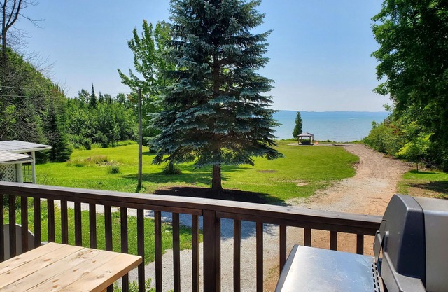 Large farmhouse style cottage located on three acres of waterfront property.