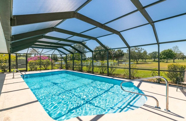 Large Tropical Pool Lakefront Golf course 4-bedroom Home Close to Jensen Beach!