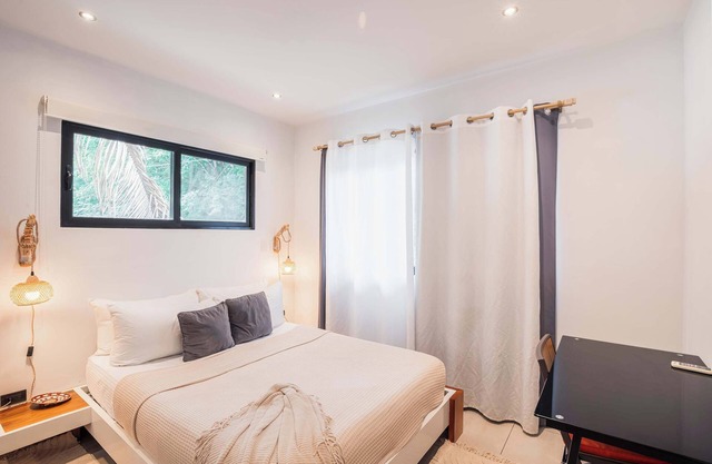 Location, location. One bedroom APT #2 is walking distance to shops, gym, surf a