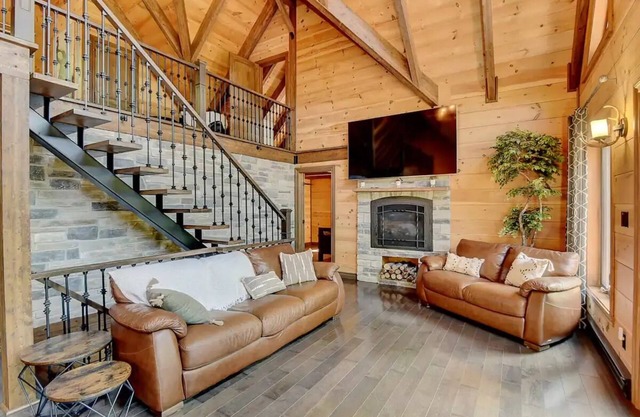 Luxurious chalet featuring a jacuzzi, pool, small lake, sauna and pool table.