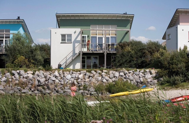 Luxury Beach Villa with balcony, terrace, fireplace, and panoramic IJsselmeer views at Beach Resort Makkum.