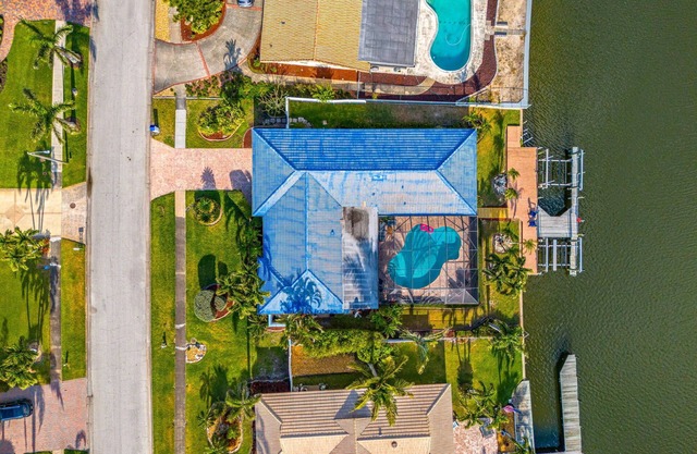 Luxury Canalfront Home w/Heated Pool, Game Room, Boat & Jet Ski Lifts