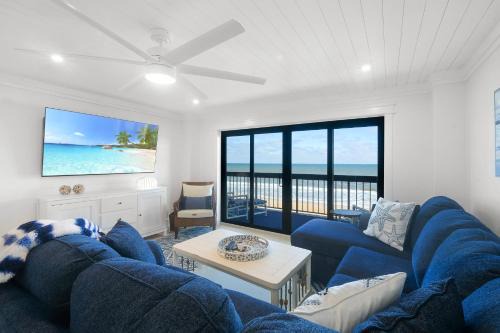 Luxury direct oceanfront corner with large private balcony, heated pool and garage