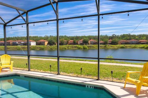 Magical 4 BR 3 BTH Themed Pool Home with Lakeview