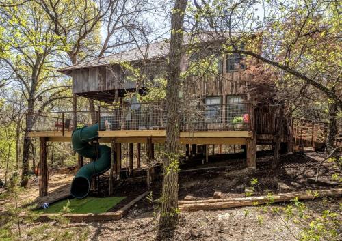 Magical Treehouse with Slide by Brazos River for Family Glamping Adventures in Texas