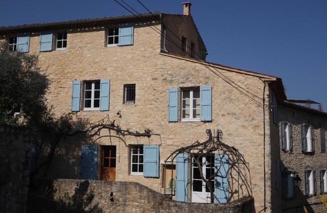 Magnificent building with swimming pool and garden in the heart of the village