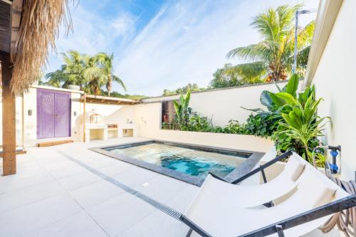 Maison balinaise avec piscine chauffée, four à pizza