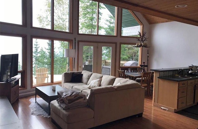 Marvel at breathtaking views surrounding you from this waterfront chalet