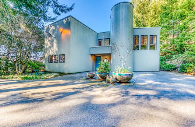 Mid-century home with floor-to-ceiling windows & great views