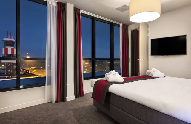 Minutes to Blijdorp Zoo, Steps to the Terminal! Onsite Dining, Airport View!