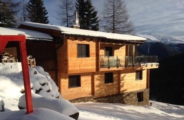 Modern comfortable spacious mountain chalet with wellness area and tiled stove