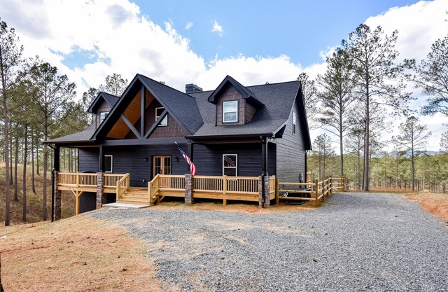 Modern mountain cabin with hot tub, stunning views, & ample entertainment space