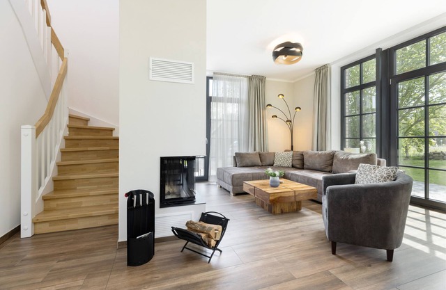 Modern thatched house "Haus Meeresleuchten" with fireplace and sauna near the beach