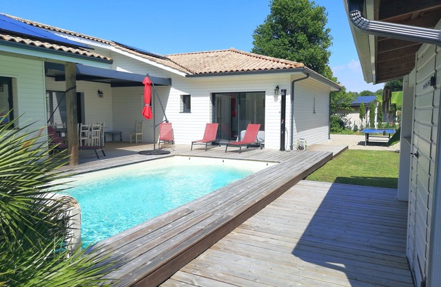 Modern wooden villa with swimming pool