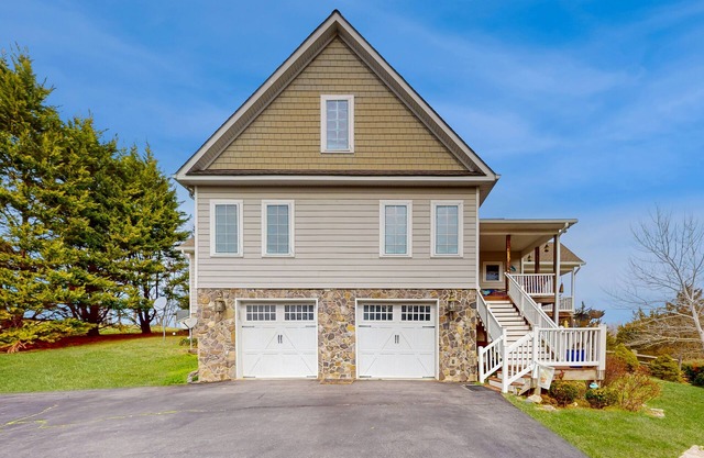 Nature lover’s lakefront home with a beach, dock, fire ring, & more