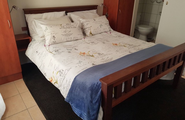 Neat, modern, comfy and secure apartment with a leafy garden and parking.