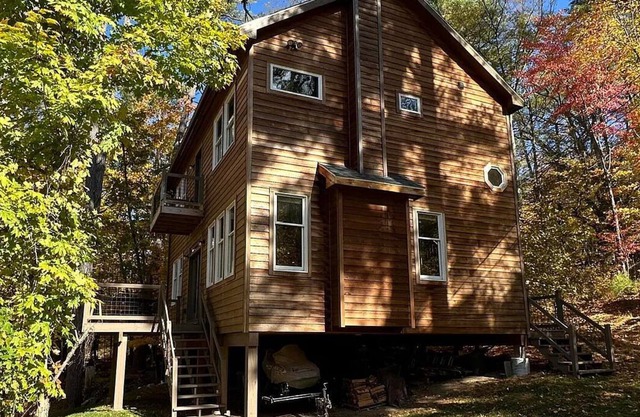 New home steps from Lake George with lake views, swimming access and boat slip