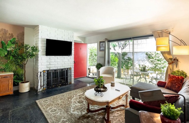 Newly remodeled, uniquely styled property surrounded by botanical-like garden setting.