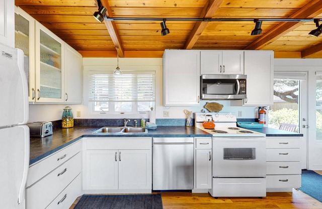 Oceanfront home with EV charger, enclosed yard, beach access and views