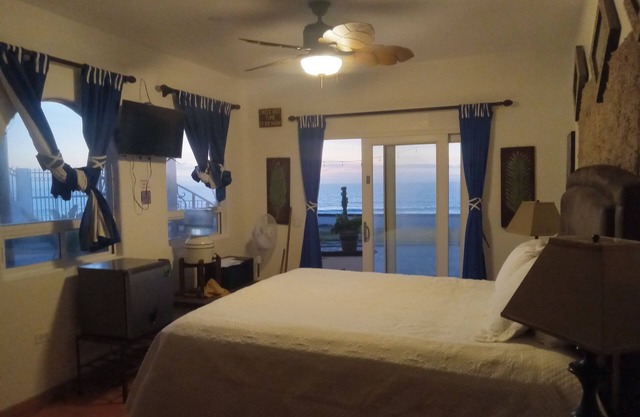 Oceanfront suite with king bed, bbq, pool, jacuzzi, private gate to the beach