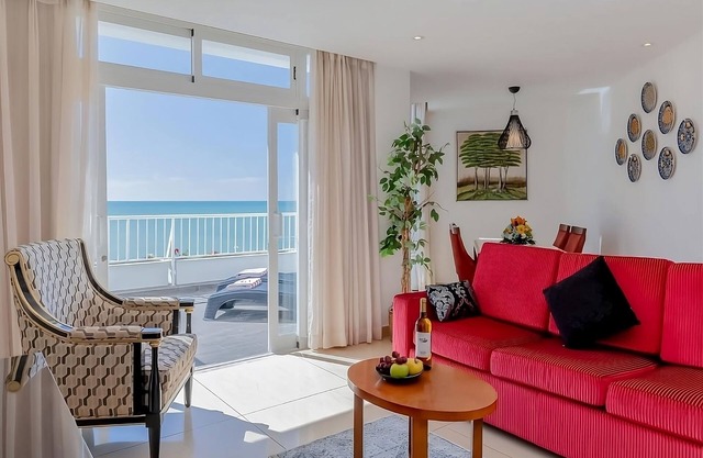 Oura Beach Escapade! Four Relaxing Suites with Kitchenettes, Pool, Beachfront!