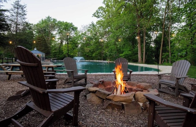 Outdoor Oasis with pickleball, swimming pond, basketball, shuffleboard & pavilion with kitchen