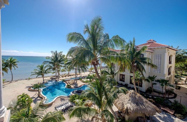 PARADISE FOUND! Tropical 2 bed 2 bath beachfront with pool