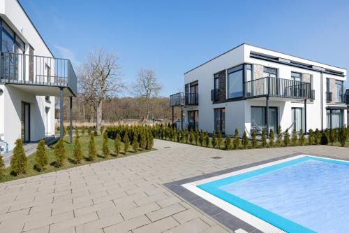 Paraiso Nadmorskie Apartamenty z Basenem i Parkingiem by Noclegi Renters