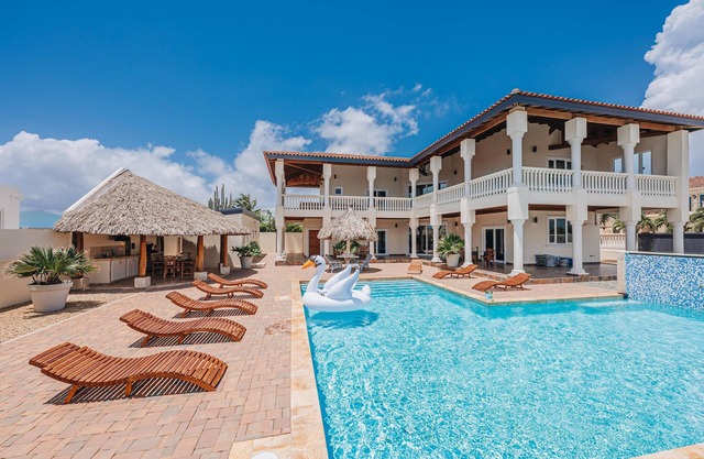 Perched on a hill in Noord, this villa is a 6-bed, 7-bath luxury retreat just minutes from Palm Beach. With 5,500 sq. ft. of indoor comfort plus expansive outdoor living, this private villa blends upscale elegance with island charm.