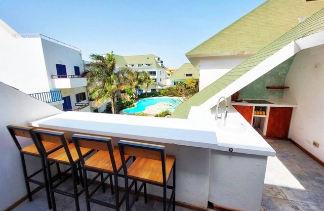Pool house with 2 balconies, next to the beach!