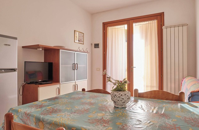 Poolside getaway seaside flat in Rosolina