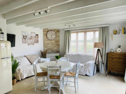 Pretty little house full of charm, located in a green and peaceful setting, very close to sea