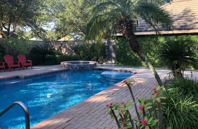Private oasis in prime McAllen location with Gated Parking, Heated Pool & Spa