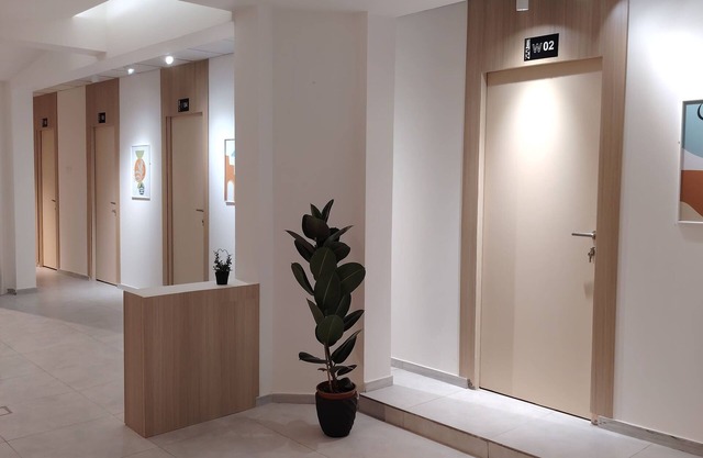 Private room 8m for men. Bed, AC, side table, Wi-Fi. Shared baths, lounges.