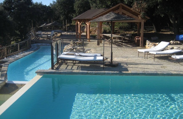 Property with 2 swimming pools and tennis court, surrounded by nature
