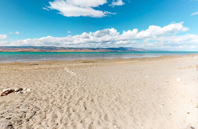 Quaint lakefront home with serene views and private beach access